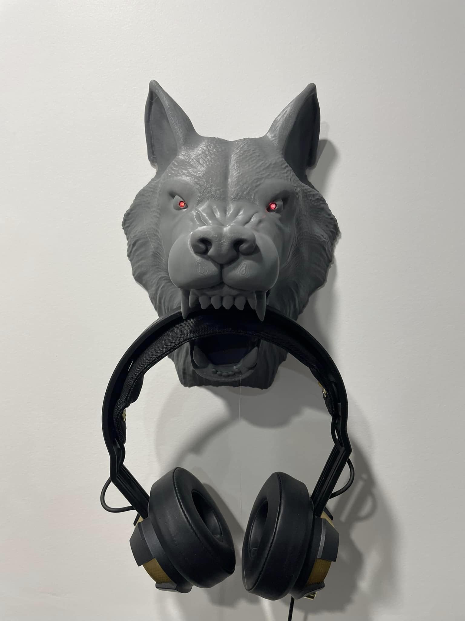 Lone Wolf Wall Companion: 3D Printed Wolf Head Wall Mount with Illuminating Red Eyes - GoodBuy.ai